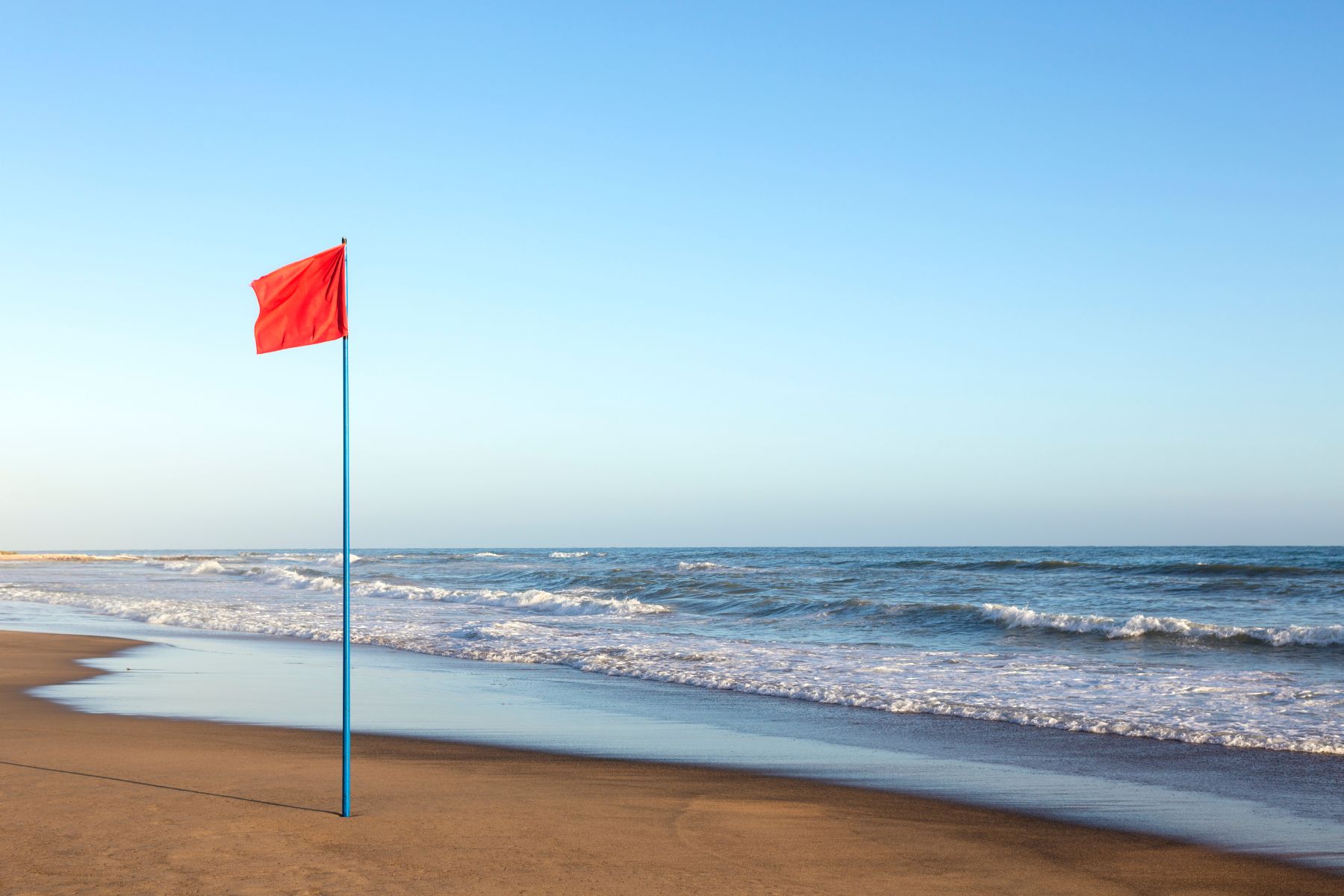 Red flag at the beach to warn beachgoers.